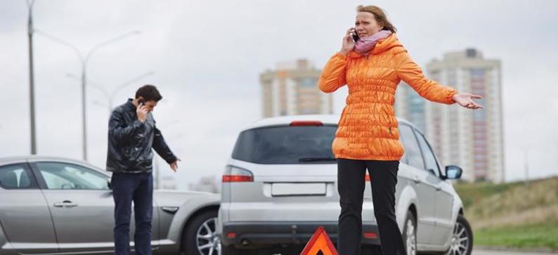 woman on the phone after a car accident