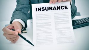 insurance agent holding contract