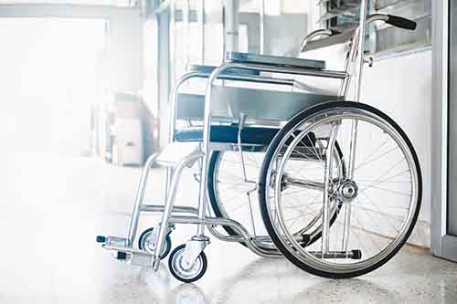 This image shows a wheelchair. Contact a Garden City spinal cord injury lawyer at Cellino Law for a free case evaluation.