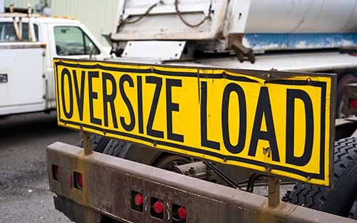 Truck with oversize load sign. Contact a Garden City truck accident lawyer at Cellino Law if you were in a crash caused by a negligent driver.