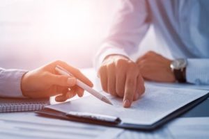 A lawyer reviewing an injury claim with a client in Cheektowaga.