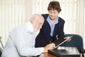 A Cheektowaga personal injury lawyer reviewing a settlement offer with a client.