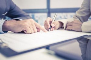 A Greenburgh personal injury lawyer reviewing a settlement offer with a client.