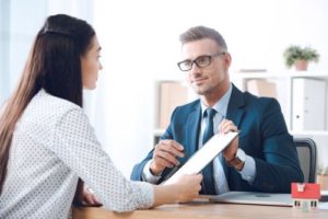Huntington A woman reviewing a claim with a Huntington personal injury lawyer.