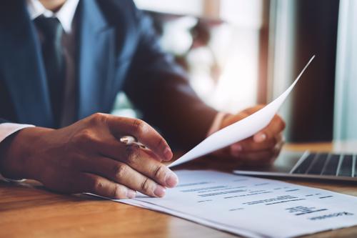 Tonawanda Car Accident Lawyer An attorney reviewing a car accident claim for a client in Tonawanda.