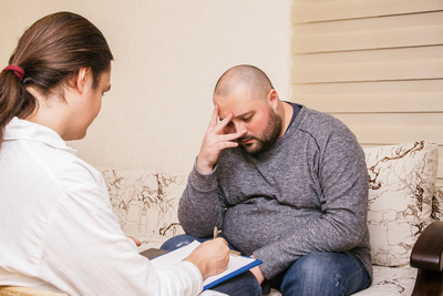 Doctor counseling a patient that has cancer because of Belviq medication