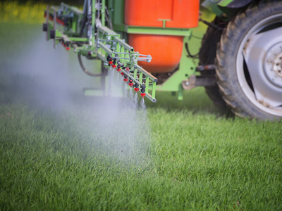 Spraying fields with Paraquat Weed Killer, a substance linked to Parkinson's disease