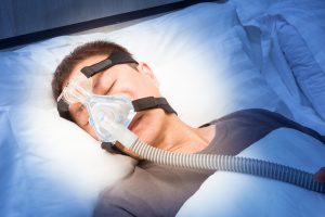 Philips CPAP Lawsuit cpap machine on sleeping person