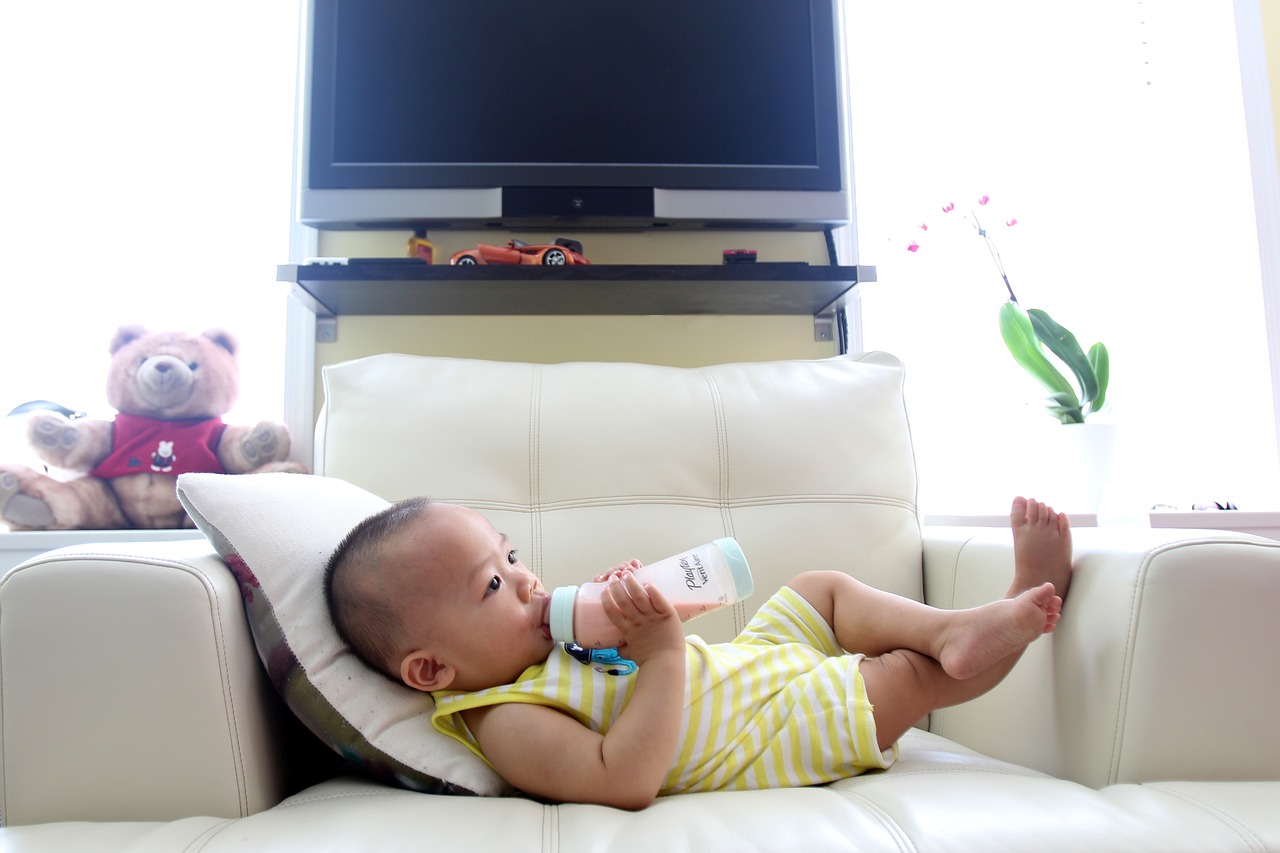 baby on sofa feeding