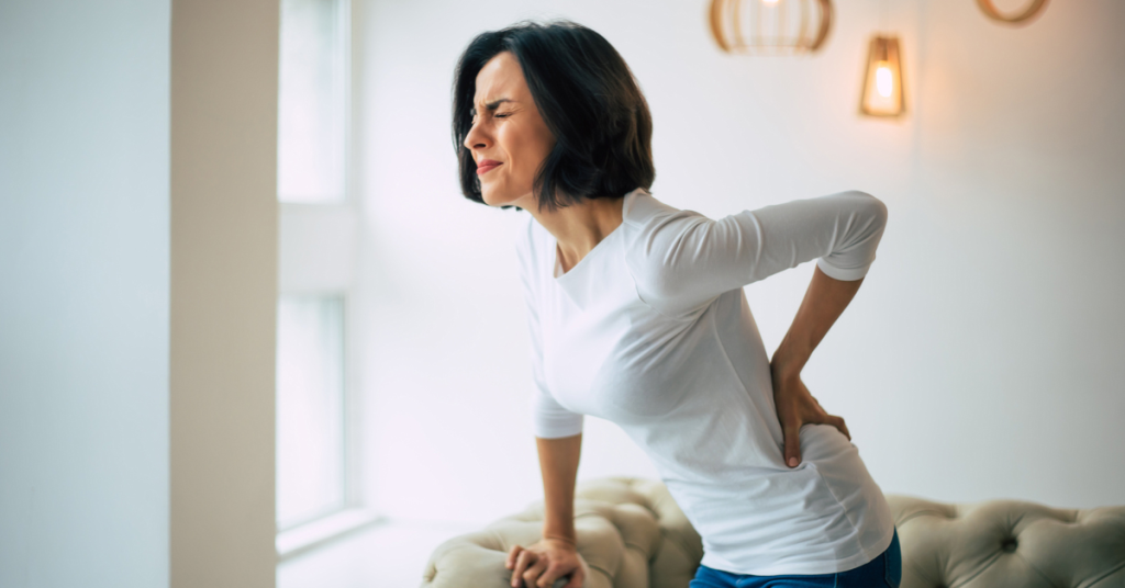 How A Pre-existing Condition Can Affect Personal Injury Claims Woman suffers back pain