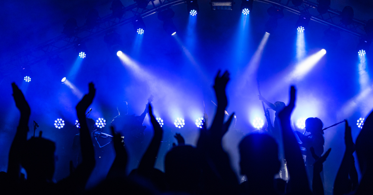 What to Do If You're Injured at a Concert Hands up in the air at a concert