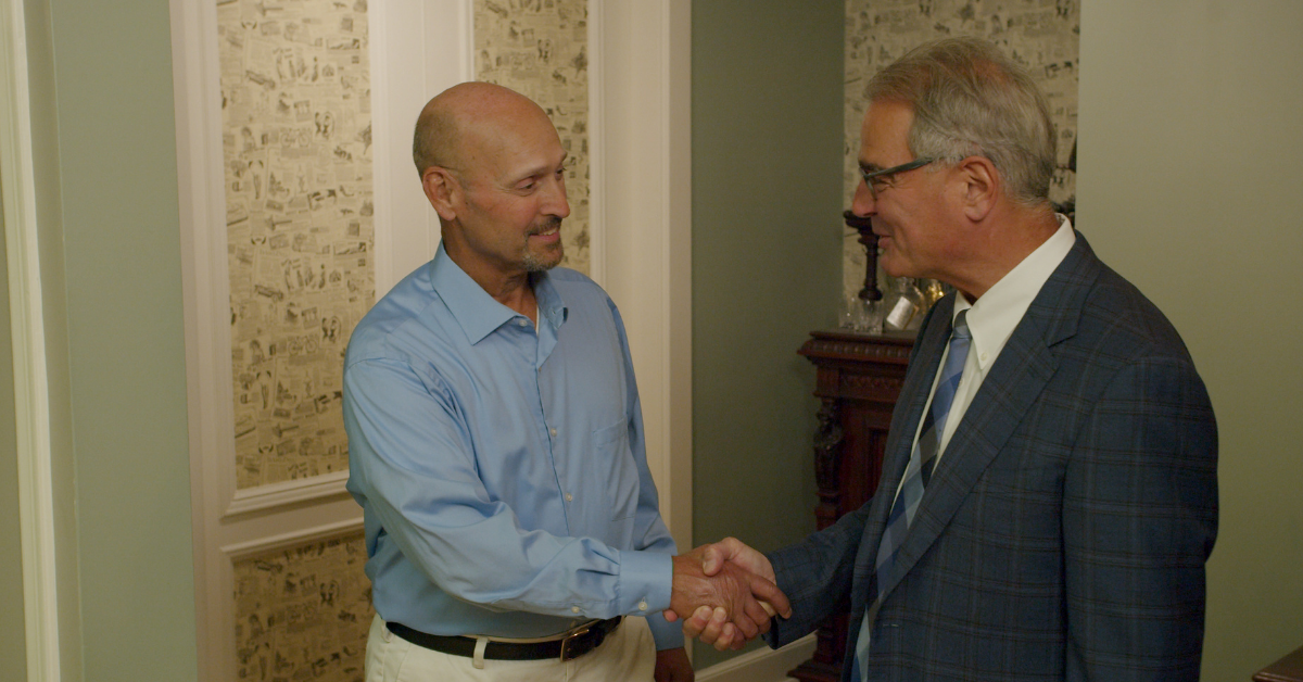 Ross Cellino of Cellino Law and Client Shaking Hands