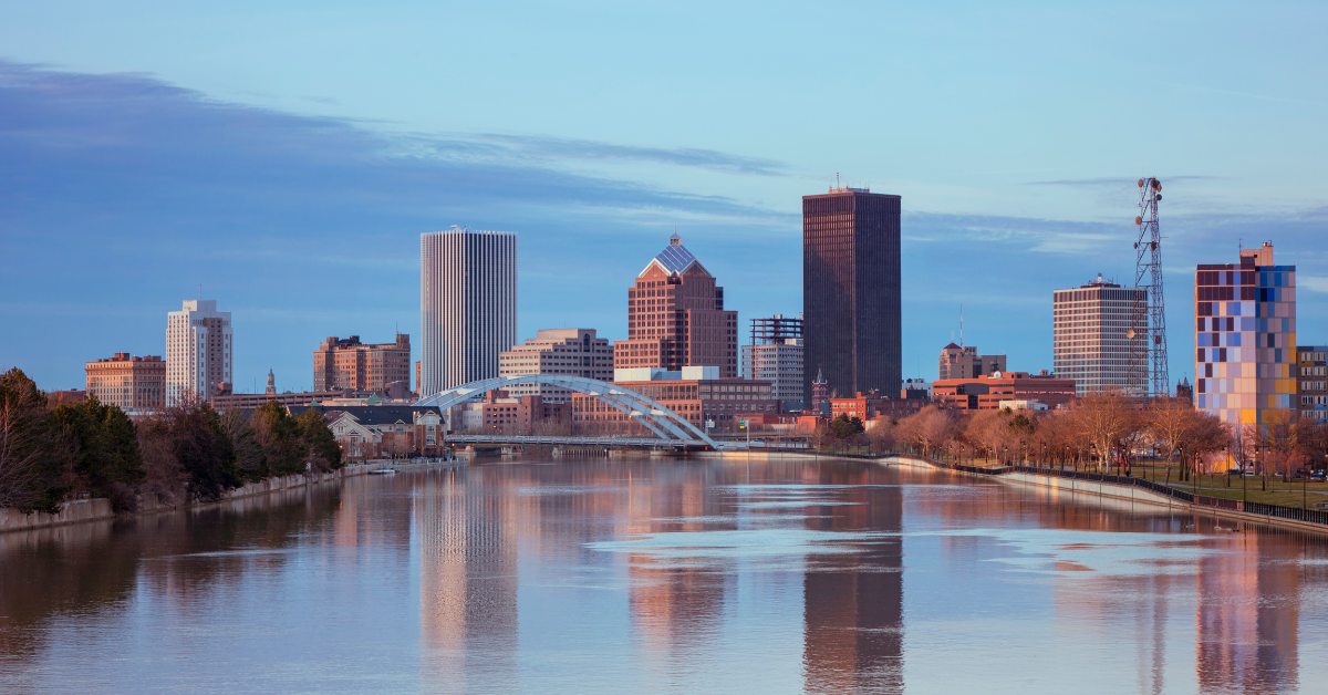 New York skyline along the Genesee River at sunset.