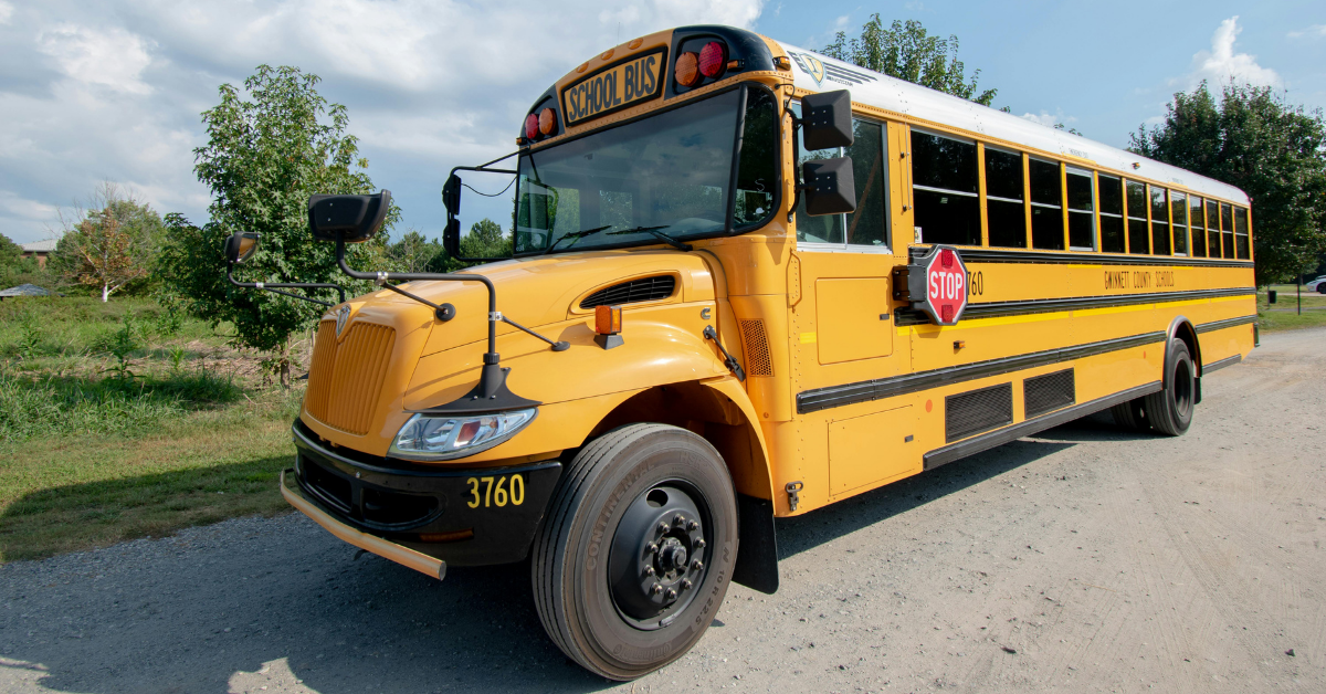 Yellow school bus parked on the side of the road