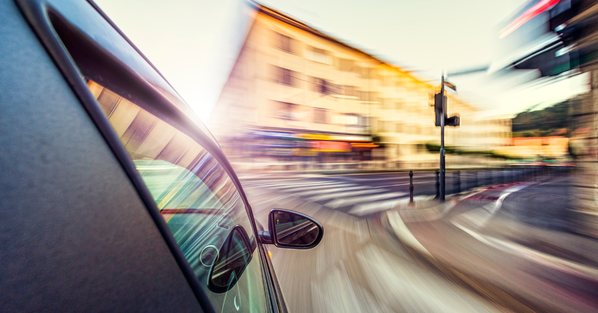 A car driving recklessly on a city street