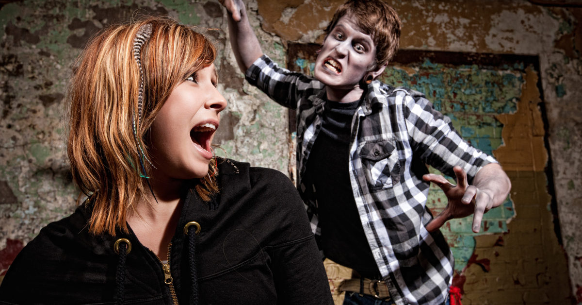 Haunted house actor scaring a guest