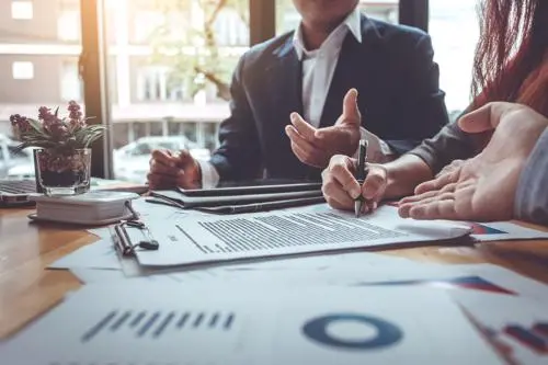 Queens Truck Accident Lawyer A Queens truck accident lawyer reviewing a settlement offer with an injured client.