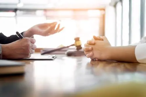 A New York City motorcycle accident lawyer reviewing a claim with a client.