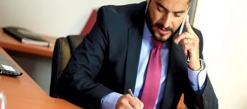 An attorney on the phone with a client in New York City who has a personal injury claim.