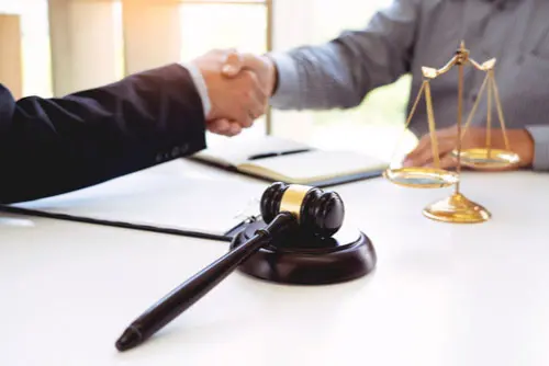 Clarkstown Car Accident Lawyer Clarkstown car accident lawyer shaking hands for settlement agreement