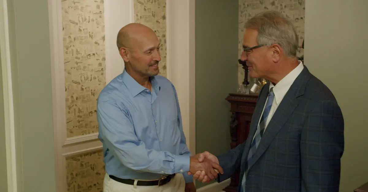 Ross Cellino of Cellino Law and Client Shaking Hands