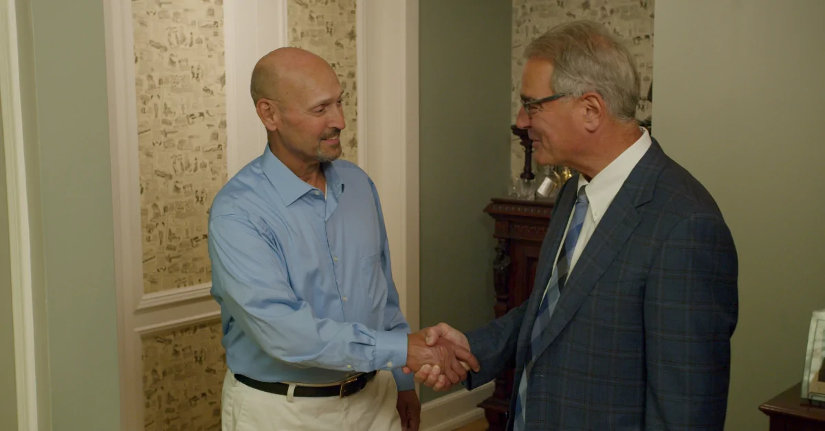 Personal injury attorney, Ross Cellino, shaking hands with a client of Cellino Law.