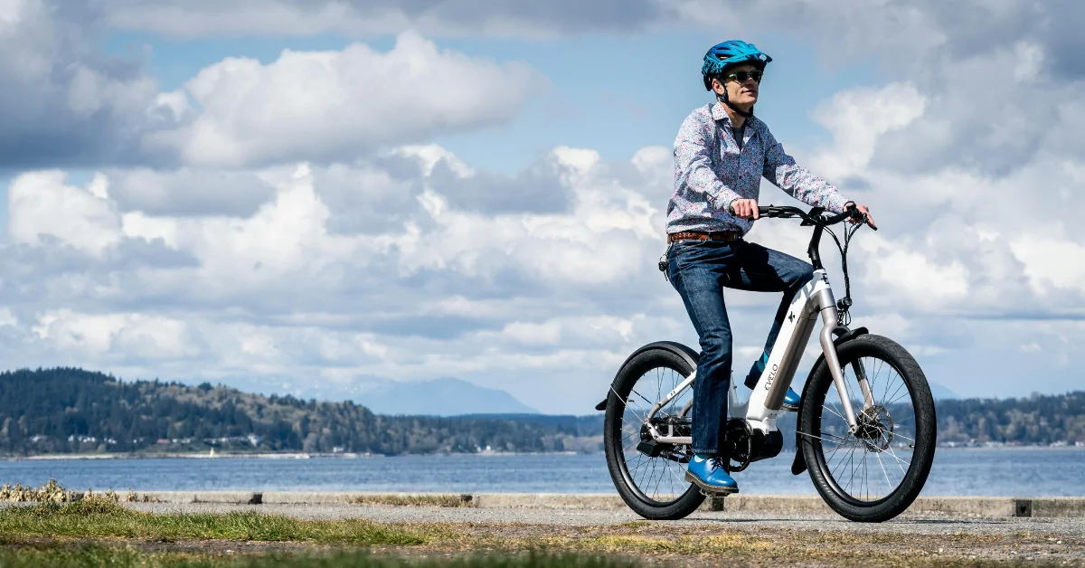 A man riding an e-bike, properly wearing a helmet in accordance with New Jersey’s recently updated e-bike laws.