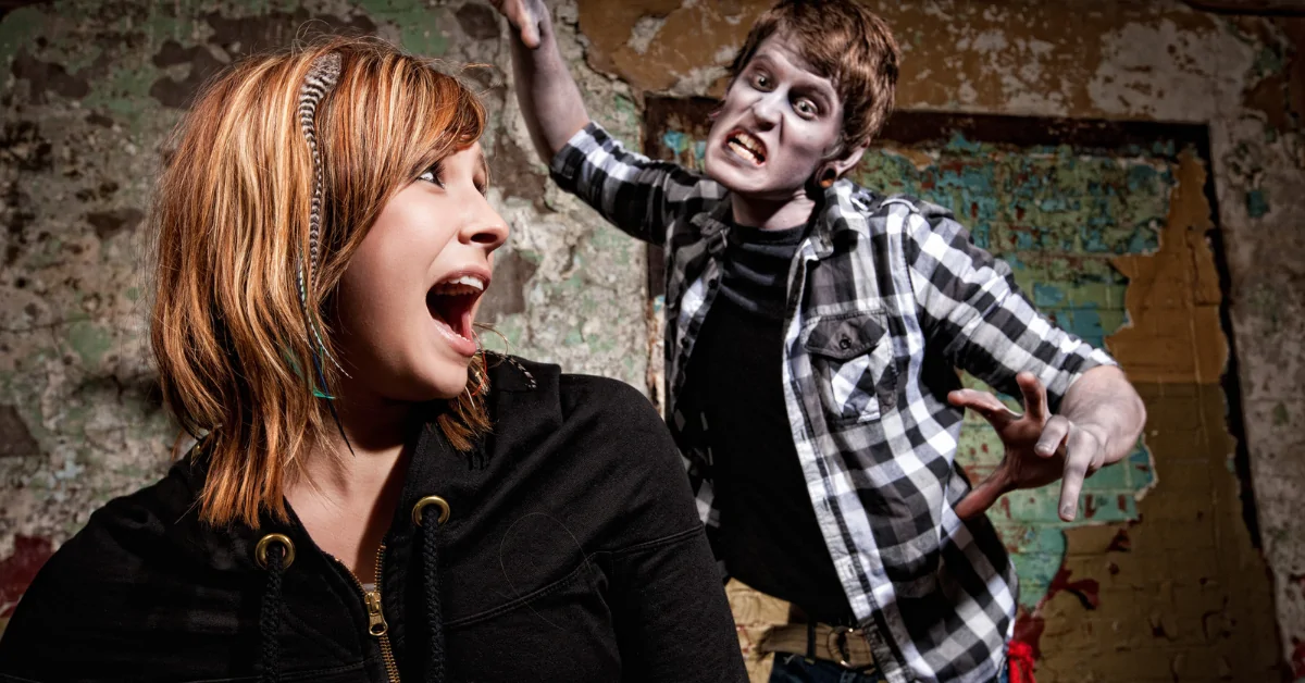 Haunted house actor scaring a guest